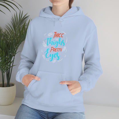 Thicc Thighs Pretty Eyes Unisex Heavy Blend™ Hooded Sweatshirt